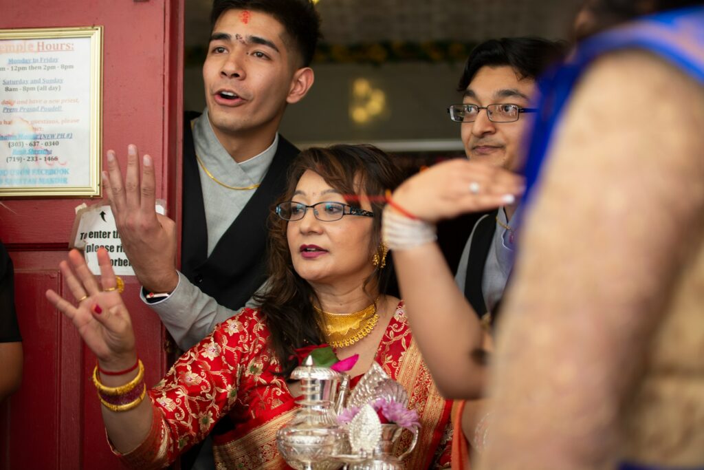 American partner practicing Namaste greeting before meeting Indian parents